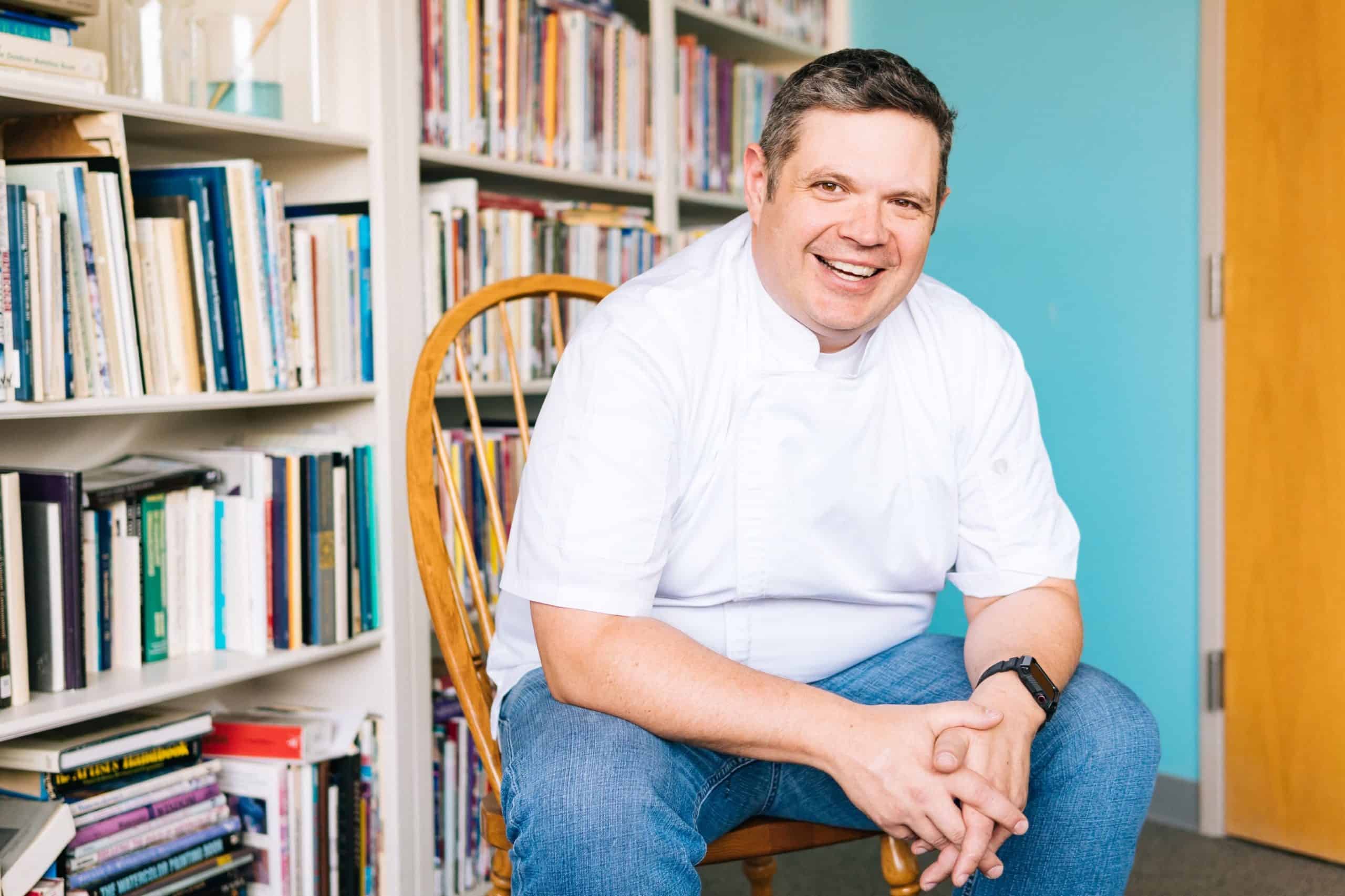 Chef Sitting in Front of Books