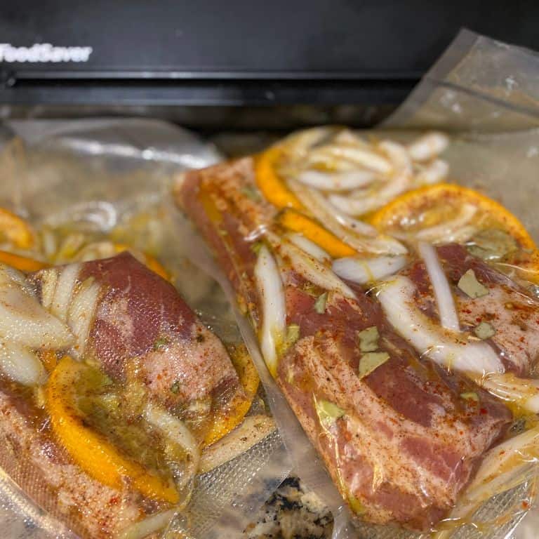Marinated Pork Belly with Oranges, Onions and Spices in Sealed Bags
