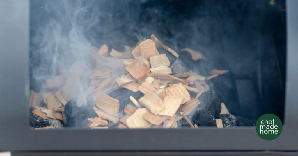 smoking wood chips on charcoal