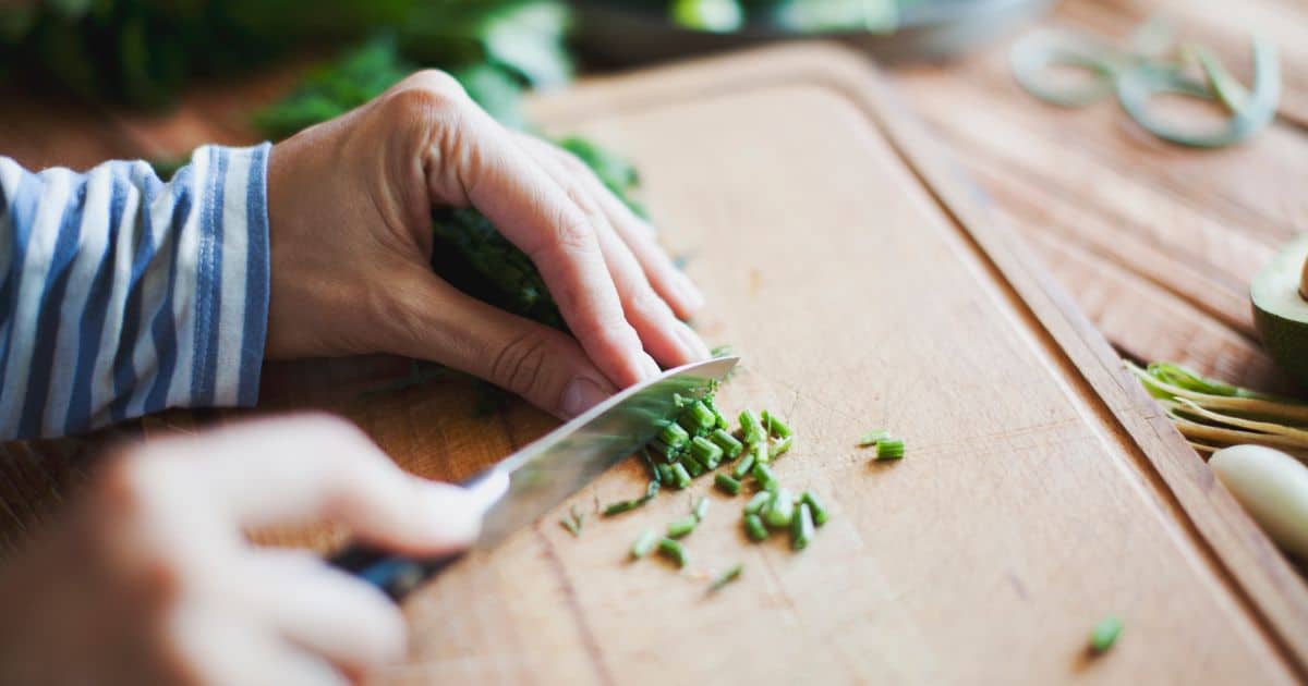 Slicing chives using a petty utility knife 